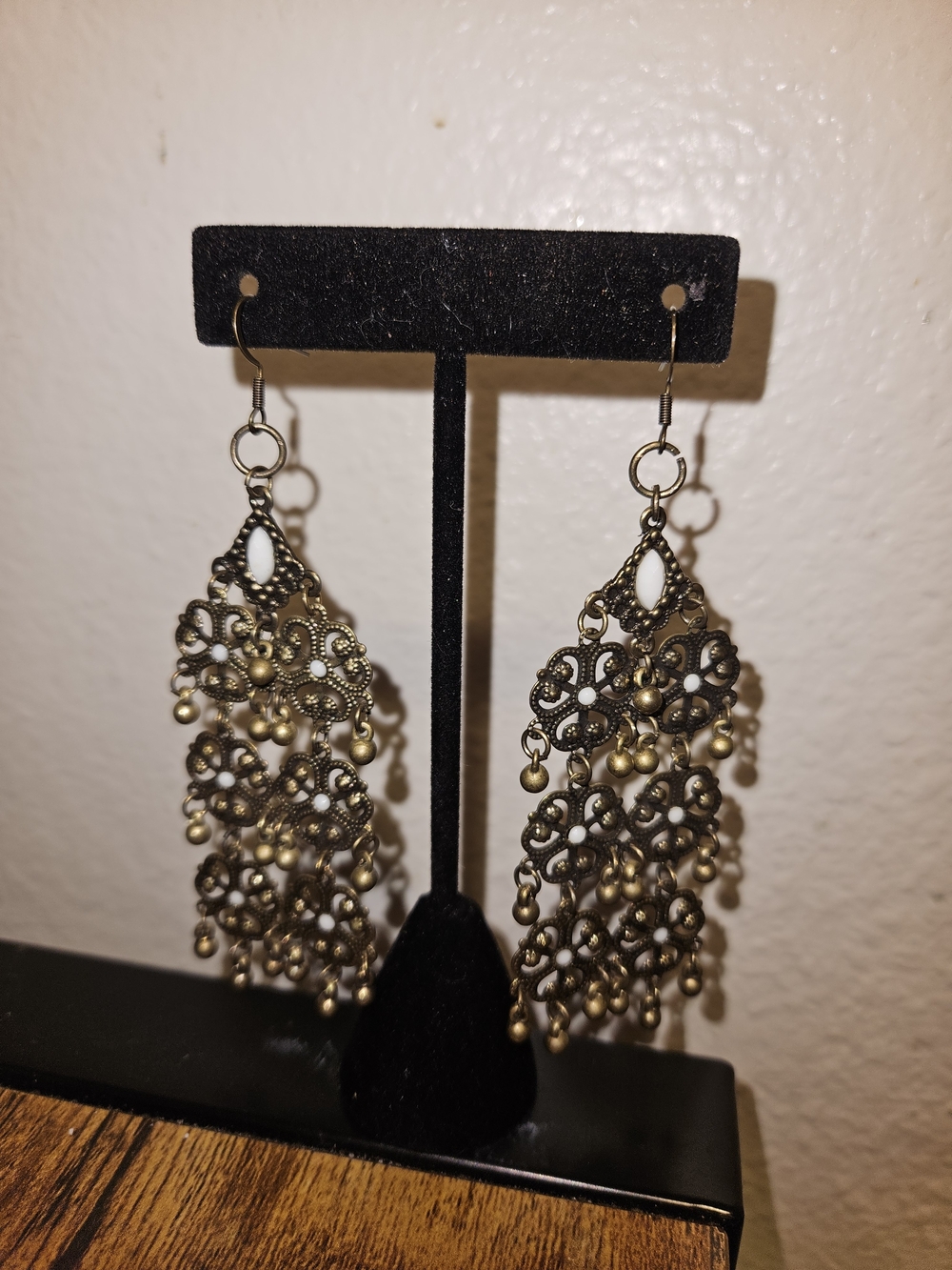 Ornate Filigree Dangle Earrings in Antique Gold with White Accents